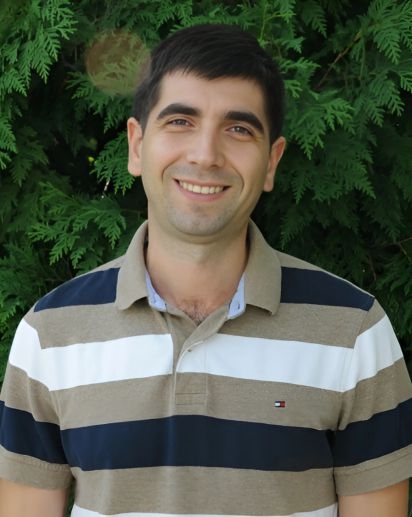 headshot of Denis Corja